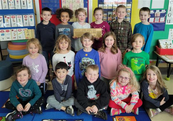Kids sitting with Golden Keyboard